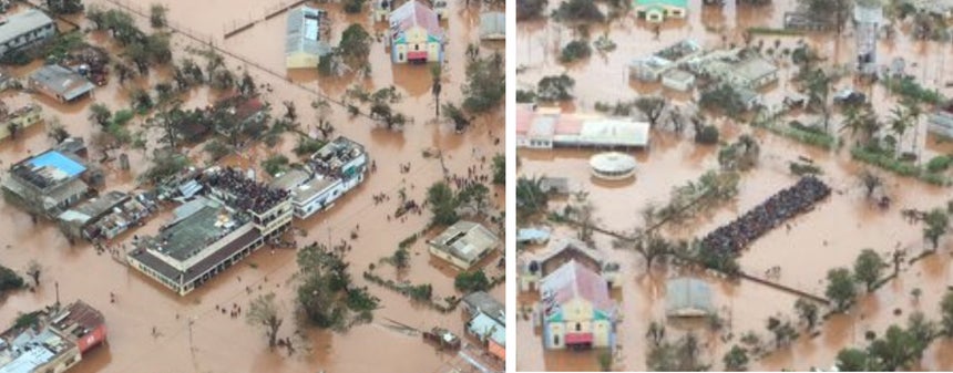 Zoom das imagens anteriores mostram dezenas de pessoas em cima dos telhados das casas Imagem da rede social <i>Twitter</i> @VOSTPT - DR.