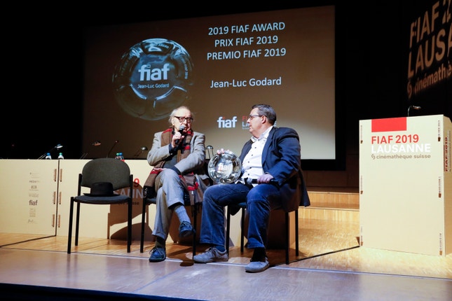 Jean-Luc Godard e Frédéric Maire — Lausanne, 11 Abril 2019<br>© Carine Roth / Cinémathèque suisse