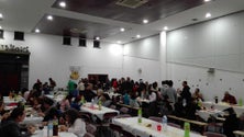 Imagem de Imigrantes reunidos em jantar de Natal (Vídeo)