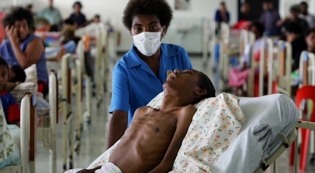 Papua Nova Guin&eacute;, 2005. Doente infetado com SIDA | David Gray - Reuters 