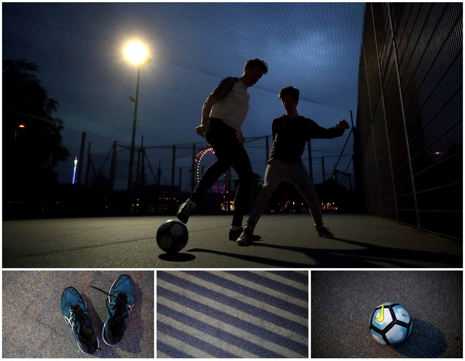  Durante a noite tamb&eacute;m se joga futebol. Dois jovens disputam uma bola num campo  em frente &agrave; roda gigante de Vienna, na &Aacute;ustria. Foto: Lisi Niesner - Reuters 