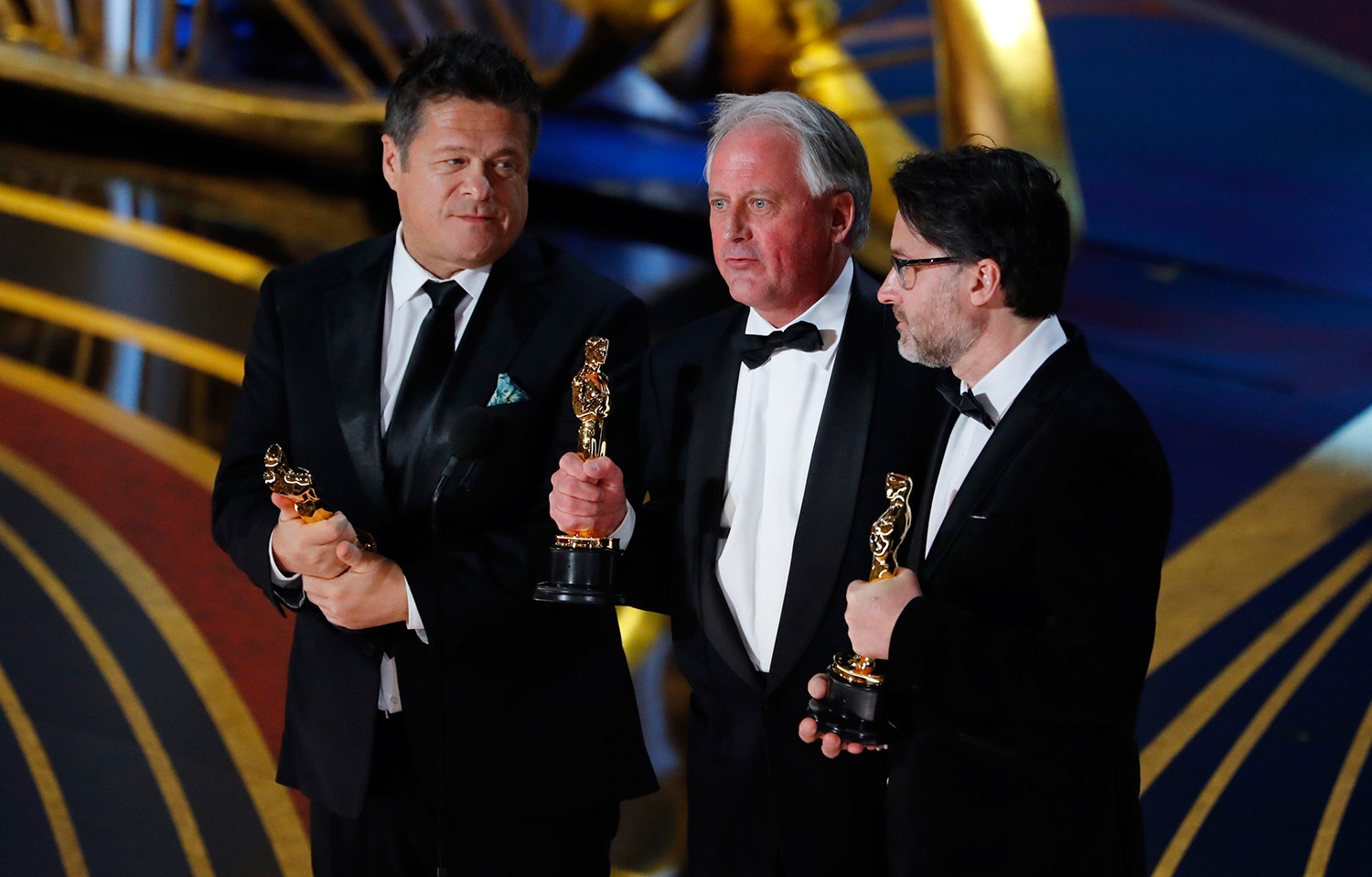  Paul Massey, Tim Cavagin e John Casali /Mike Blake - Reuters 