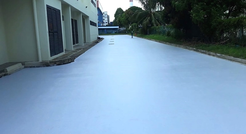 Pavimento da estrada do local da experiência em Singapura com revestimentos de pintura
