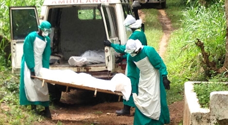 Enterro de vítima do vírus Ébola na Serra Leoa em junho de 2014 (foto: Reuters) Enterro de vítima do vírus Ébola na Serra Leoa em junho de 2014 (foto: Reuters)