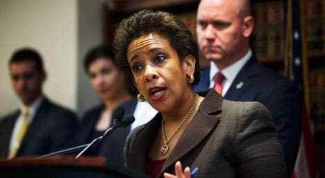 A procuradora Loretta Lynch acusou o grupo de realizar uma "flash mob criminosa" A procuradora Loretta Lynch acusou o grupo de realizar uma "flash mob criminosa"